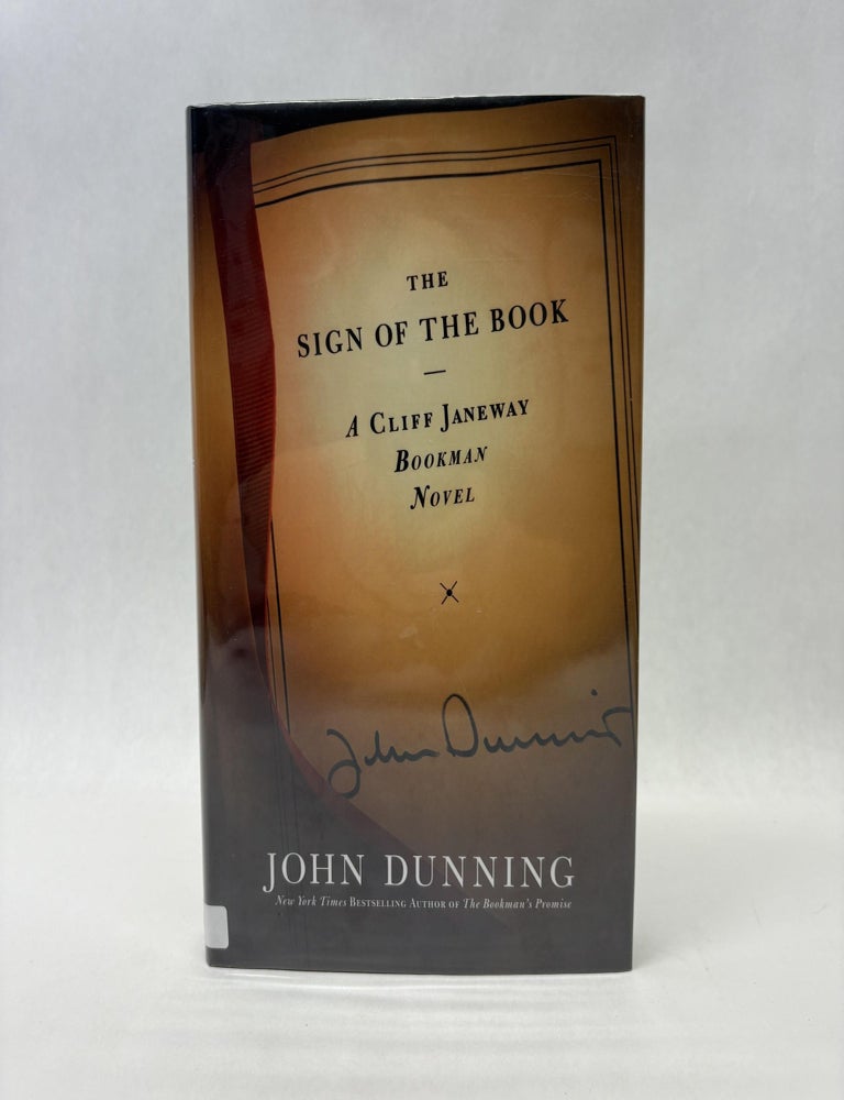 Item #56057 THE SIGN OF THE BOOK. John Dunning.