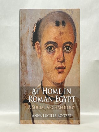 Item #62590 AT HOME IN ROMAN EGYPT: A SOCIAL ARCHAEOLOGY. Anna Lucille Boozer